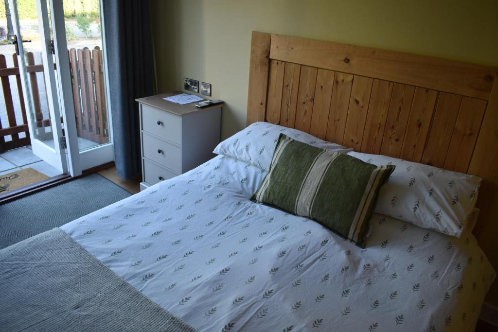 The Inny pod, with a double bed and patio doors opening onto the garden